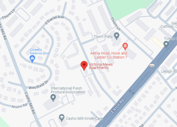 a map of a street with a red point at the intersection of a city street