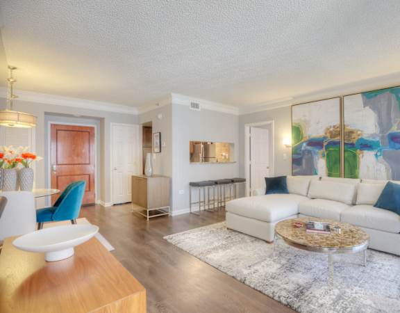 a living room with a white couch and a coffee table