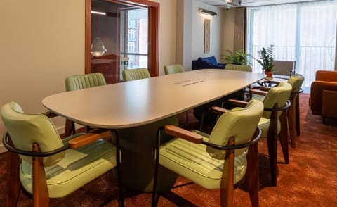 a conference room with a large table and chairs