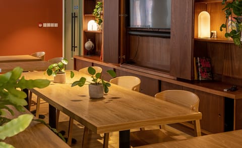 a dining room with a wooden table and chairs