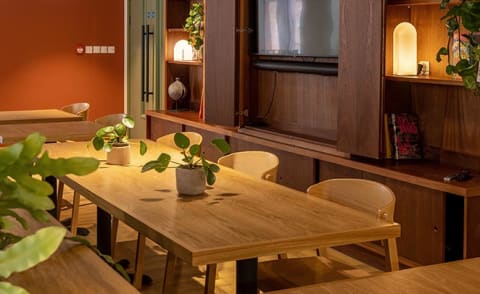 a dining room with a wooden table and chairs
