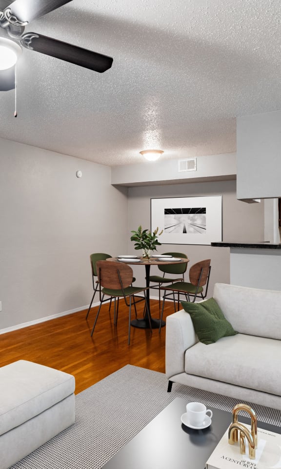 an open living room and dining room with a couch and a table