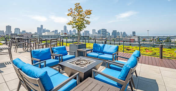 Rooftop deck seating area with Seattle skyline view