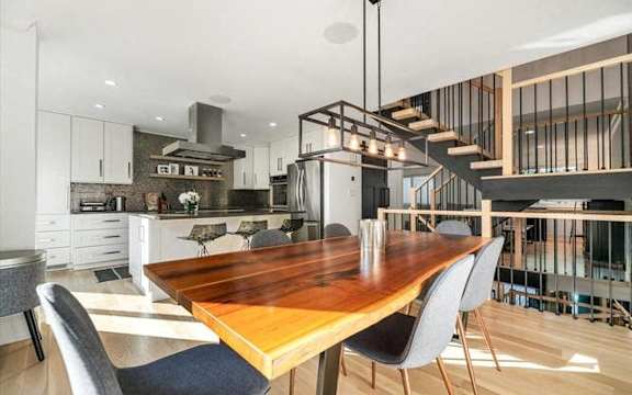 a kitchen and dining room with a table and chairs