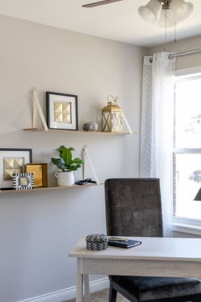 a home office with a desk and a chair