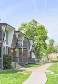 A row of houses with a walkway in between.