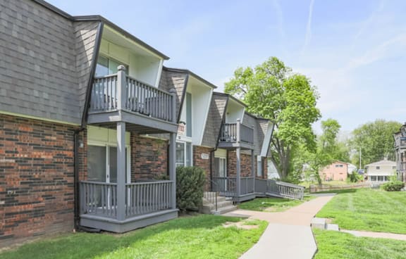 A row of houses with a walkway in between.