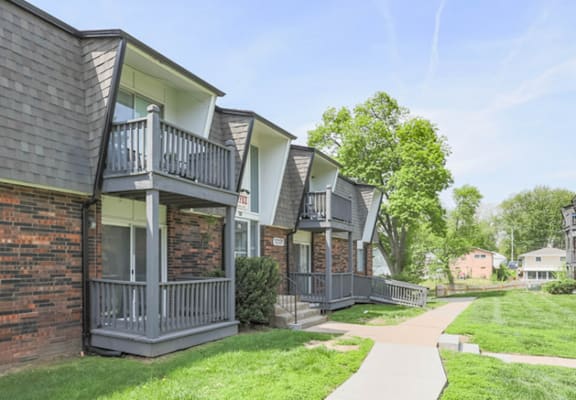 A row of houses with a walkway in between.