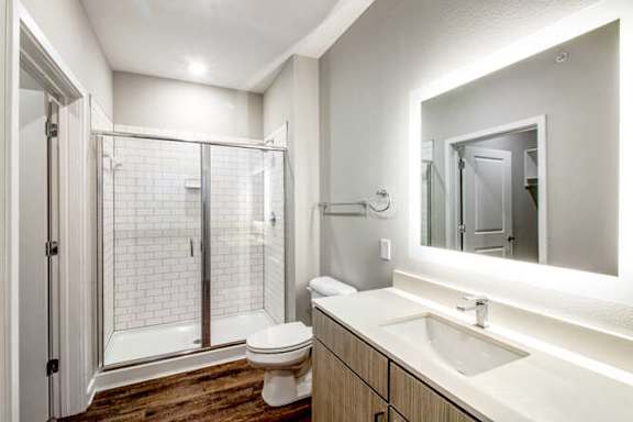 a bathroom with a sink toilet and a shower at Watermark at Urban Blu, Panama City Beach, Florida