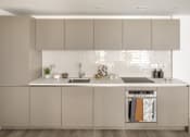 Thumbnail 5 of 12 - a white kitchen with stainless steel appliances and white cabinets
