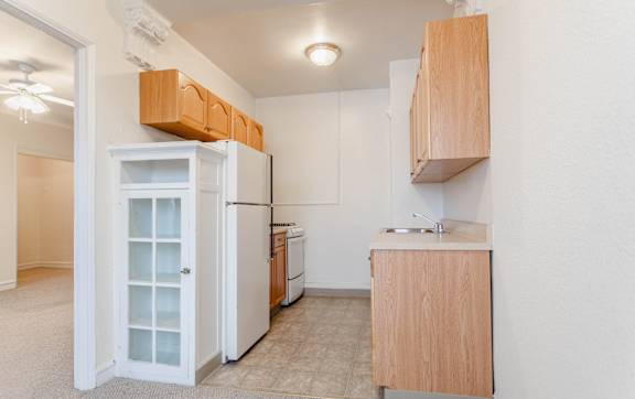 Kitchen with white appliances at Lifestyle Apartments at Syracuse, Syracuse, NY, 13203