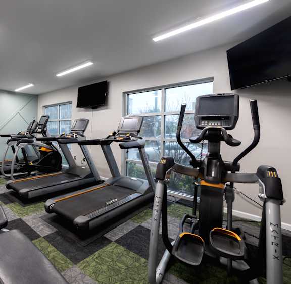 Fitness center at 310 at Nulu Apartments-Student, Louisville Kentucky