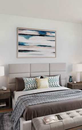 A bedroom with a large bed and a painting above it.