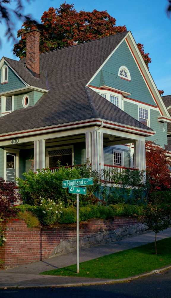 a house with a street sign in front of it
