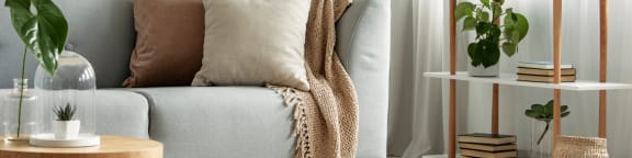 a living room with a couch and pillows on it