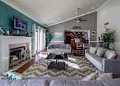 Thumbnail 17 of 28 - A living room with a fireplace and a couch. at Landmark at Lyncrest Reserve Apartments, Nashville, TN