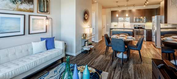 a living room and dining room with a couch and a table