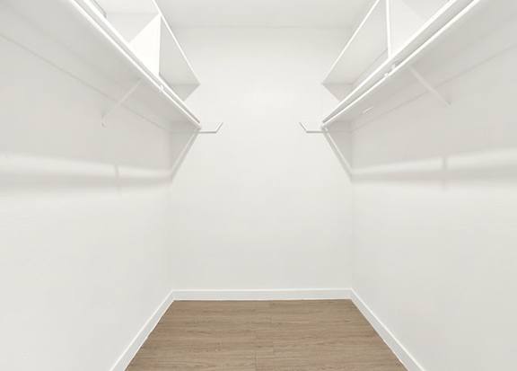 A white empty room with wooden flooring and white walls. at Bonnie Brae Apartments, California