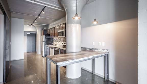 A modern kitchen with a large island in the middle.