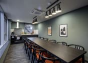 Thumbnail 4 of 8 - a long table and chairs in a room with a kitchen