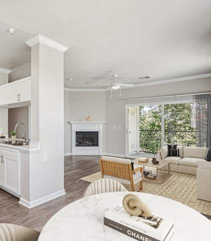 A modern kitchen with white cabinets and a large island.