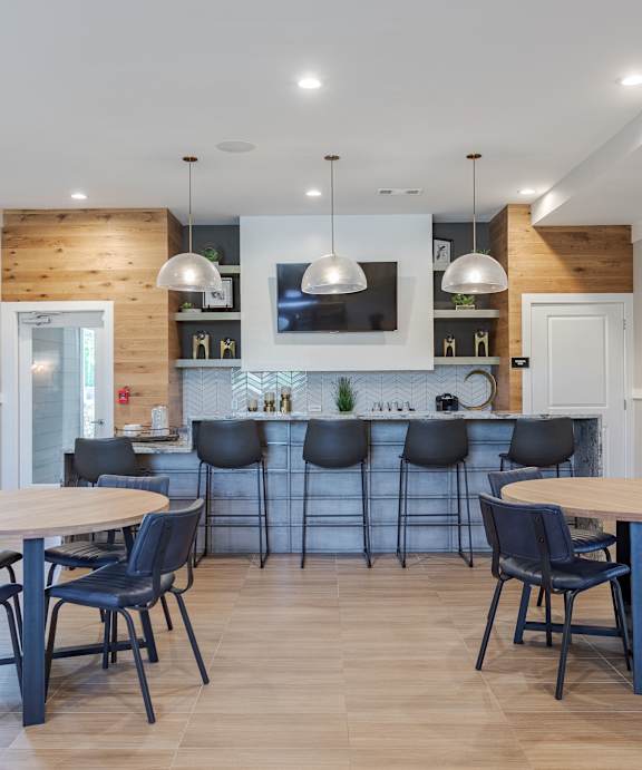 a living room and dining room with a table and chairs  at Lullwater at Big Ridge, Hixson, TN, 37343