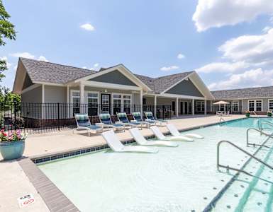 our apartments have a large resort style pool with lounge chairs
