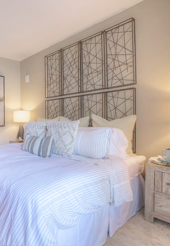 a bedroom with a bed and a door to a bathroom  at Lullwater at Big Ridge, Hixson, TN, 37343