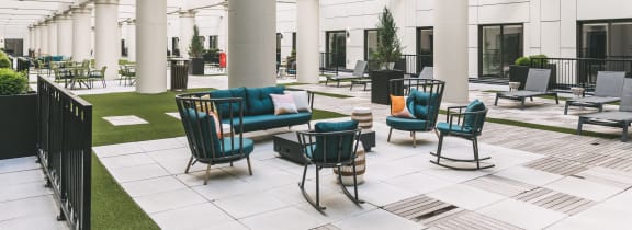 the lobby of a building with chairs and couches