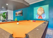 Thumbnail 1 of 5 - a billiards table in a game room with a orange pool table at Proximity at ODU, Norfolk, Virginia