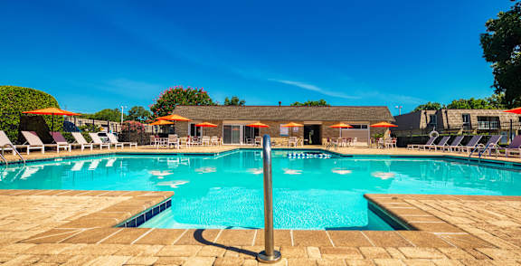 an aerial view of a swimming pool with tables and chairs around it at Bayville Apartments, Virginia