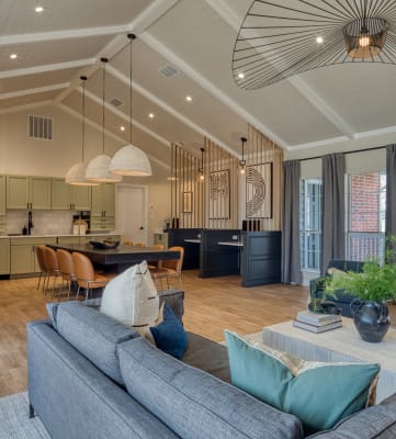 an open concept living room and kitchen with a vaulted ceiling at The Crest on Hampton Hollow, Silver Spring, Maryland