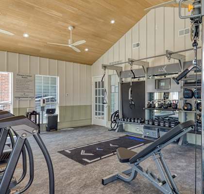 a home gym with weights and exercise equipment at The Crest on Hampton Hollow, Silver Spring, Maryland