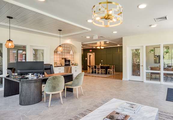 A modern living room with a television, chairs, and a dining area.