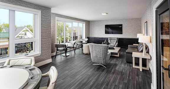 a living room with couches and chairs and a table and a television