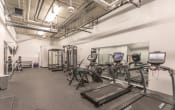Thumbnail 23 of 26 - a large fitness room with treadmills and other exercise equipment