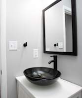 A bathroom with a sink and mirror.at Liberty Crossing, Jacksonville