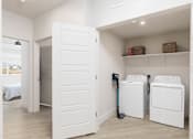 Thumbnail 14 of 24 - Laundry room with shelf and basket on it at The Vue At Desert Color, Utah, 84790