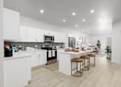 Thumbnail 1 of 24 - Modern White Furniture in Kitchen at The Vue At Desert Color, Utah, 84790