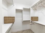 Thumbnail 7 of 24 - Empty Baskets in walk-in closet at The Vue At Desert Color, St. George, Utah