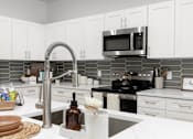 Thumbnail 10 of 24 - Oven in kitchen at The Vue At Desert Color, St. George, Utah