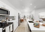 Thumbnail 5 of 24 - Equipped Kitchen and Living Room at The Vue At Desert Color, Utah, 84790