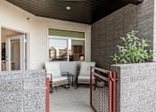 Thumbnail 17 of 24 - Patio with a white chair at The Vue At Desert Color, Utah, 84790