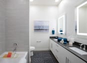 Thumbnail 15 of 19 - a bathroom with a tub and a sink
