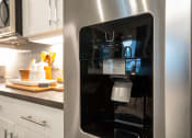 Thumbnail 4 of 19 - a stainless steel refrigerator with a coffee maker inside