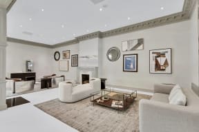 a living room with couches and a coffee table and a fireplace