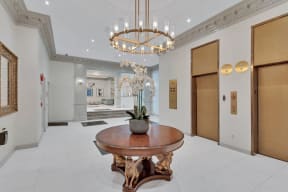 a dining room with a table and a chandelier