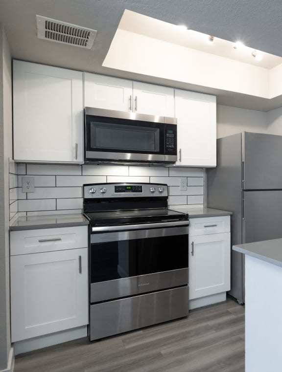a kitchen with stainless steel appliances and a sink