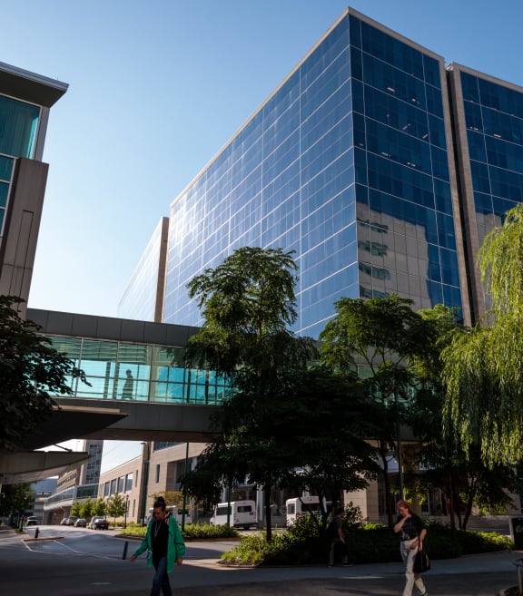 people walk outside of a building