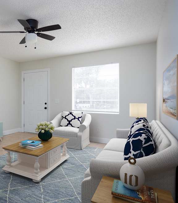 a living room with a ceiling fan and a tv